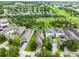 Aerial view of a home in a neighborhood with lake views and manicured lawns at 15647 Braintree Ln, Winter Garden, FL 34787