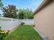 Well maintained backyard with white picket fence and green grass at 15647 Braintree Ln, Winter Garden, FL 34787