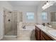 Bathroom with a shower, soaking tub, and double sink vanity at 15647 Braintree Ln, Winter Garden, FL 34787