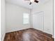 Cozy bedroom with wood flooring, closet, and a bright window at 15647 Braintree Ln, Winter Garden, FL 34787