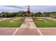 Community park featuring a clock tower, manicured green spaces and an open plaza area for resident use at 15647 Braintree Ln, Winter Garden, FL 34787
