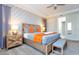 This bedroom features a patterned wall, a king size bed, and two night stands at 1625 Nassau Point Trl, Kissimmee, FL 34747