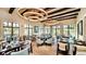 Bright dining room with elegant lighting, large windows, and modern furnishings for a comfortable dining experience at 1625 Nassau Point Trl, Kissimmee, FL 34747