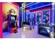 This fun game room features vibrant colors, murals, and an assortment of entertaining activities at 1625 Nassau Point Trl, Kissimmee, FL 34747