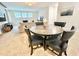 Cozy living space with unique round dining table and carpeted floors at 1625 Nassau Point Trl, Kissimmee, FL 34747