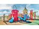 Colorful community playground with slides, climbing structures, and safety surfacing for to enjoy at 1625 Nassau Point Trl, Kissimmee, FL 34747