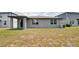 A large, well-maintained backyard provides plenty of space for recreation and relaxation at 17363 Million Lakes Ct, Clermont, FL 34714