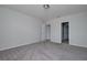Bright bedroom features neutral paint, carpet floors, and two entrances at 17363 Million Lakes Ct, Clermont, FL 34714