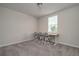 Neutral bedroom with a large window, and room for study area at 17363 Million Lakes Ct, Clermont, FL 34714