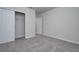 Neutral-toned bedroom with carpet flooring and ample closet space at 17363 Million Lakes Ct, Clermont, FL 34714