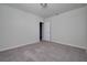 Bright bedroom with carpet flooring, a closet, and a neutral color scheme, creating a cozy atmosphere at 17363 Million Lakes Ct, Clermont, FL 34714