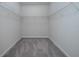 Walk-in closet with wall mounted shelves at 17363 Million Lakes Ct, Clermont, FL 34714