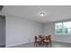 Bright dining area with natural light from window overlooking the backyard at 17363 Million Lakes Ct, Clermont, FL 34714
