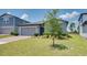 Charming single-Gathering home with well-manicured lawn and two car garage at 17363 Million Lakes Ct, Clermont, FL 34714