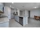 This kitchen features granite counters, stainless steel appliances, an island with sink, and an eat-in breakfast nook at 17363 Million Lakes Ct, Clermont, FL 34714