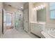 Bright bathroom with a glass enclosed shower, tub, and double sink vanity at 1740 Standing Rock Cir, Oakland, FL 34787
