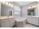 This spacious bathroom features dual sinks and a large soaking tub at 1740 Standing Rock Cir, Oakland, FL 34787