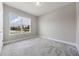 Bright bedroom features a large window with views of lush landscaping at 1740 Standing Rock Cir, Oakland, FL 34787