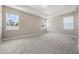 Spacious bedroom with tray ceilings and ample natural light from three large windows at 1740 Standing Rock Cir, Oakland, FL 34787