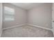 Bedroom featuring neutral walls, carpeted floors, and a window providing natural light at 1740 Standing Rock Cir, Oakland, FL 34787