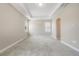 A cozy bedroom features neutral walls, plush carpet, and bright windows at 1740 Standing Rock Cir, Oakland, FL 34787