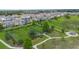 Aerial shot of community park with large green space, walking paths, picnic pavilion, and dog park with a black fence at 1740 Standing Rock Cir, Oakland, FL 34787