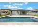The property features a swimming pool, spa, covered patio, and solar panels at 1740 Standing Rock Cir, Oakland, FL 34787