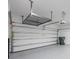 Spacious garage with overhead storage and epoxy flooring at 1740 Standing Rock Cir, Oakland, FL 34787