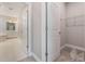 Hallway leading to a bathroom and a walk-in closet for storage at 1740 Standing Rock Cir, Oakland, FL 34787