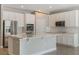 Modern kitchen with stainless steel appliances, quartz countertops, and a center island with seating at 1740 Standing Rock Cir, Oakland, FL 34787