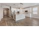 Bright, modern kitchen with white cabinetry, stainless steel appliances, and a large center island at 1740 Standing Rock Cir, Oakland, FL 34787