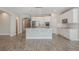 Spacious kitchen featuring a center island, stainless steel appliances, and ample cabinet space at 1740 Standing Rock Cir, Oakland, FL 34787