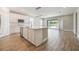 Well-lit kitchen with island, stainless appliances, and sliding glass doors leading to a patio at 1740 Standing Rock Cir, Oakland, FL 34787