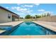 This home includes a beautiful pool surrounded by a well-manicured lawn at 1740 Standing Rock Cir, Oakland, FL 34787