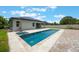 An inviting swimming pool and landscaping are the centerpieces of the backyard at 1740 Standing Rock Cir, Oakland, FL 34787