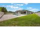 Wide backyard view of pool with a small amount of green grass at 1740 Standing Rock Cir, Oakland, FL 34787