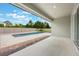The covered patio overlooks the pool and the lush landscaping in the backyard at 1740 Standing Rock Cir, Oakland, FL 34787