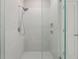 This modern walk-in shower features tiled walls and niche storage at 1740 Standing Rock Cir, Oakland, FL 34787