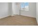 Bedroom featuring neutral carpet and window at 1797 Archer Dr, Minneola, FL 34715