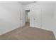 Spacious carpeted bedroom offering ample natural light at 1797 Archer Dr, Minneola, FL 34715