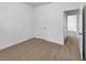 Comfortable carpeted bedroom with a door and doorway at 1797 Archer Dr, Minneola, FL 34715