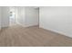 Open living room with neutral carpet at 1797 Archer Dr, Minneola, FL 34715