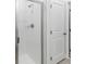 Modern bathroom featuring a stand up shower with glass door and white tiling at 1797 Archer Dr, Minneola, FL 34715