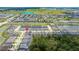 High angle view of property within a developed neighborhood with community amenities and scenic greenery at 1809 Tropical Palms Cir, Kissimmee, FL 34747