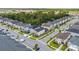 Aerial view of a residential area highlighting the home's placement on a corner lot within a lush, green landscape at 1809 Tropical Palms Cir, Kissimmee, FL 34747