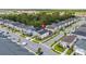 Aerial view of a residential area highlighting the home's placement on a corner lot within a lush, green landscape at 1809 Tropical Palms Cir, Kissimmee, FL 34747