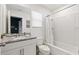 Bright bathroom features granite countertops, modern fixtures, and a tub with a shower at 1809 Tropical Palms Cir, Kissimmee, FL 34747