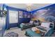 Fun bedroom featuring Star Wars decor, comfortable beds, and modern lighting at 1809 Tropical Palms Cir, Kissimmee, FL 34747