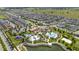 Aerial view showcasing the community clubhouse with pools, playground, and abundant parking at 1809 Tropical Palms Cir, Kissimmee, FL 34747