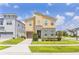 Contemporary two-story home boasts modern design and manicured lawn at 1809 Tropical Palms Cir, Kissimmee, FL 34747